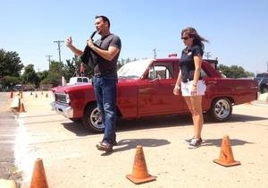 Kansas Magician and Mentalist Curtis Waltermire speaking to the crowd at Blacktop Nationals 2013 before his blindfold drive stunt.